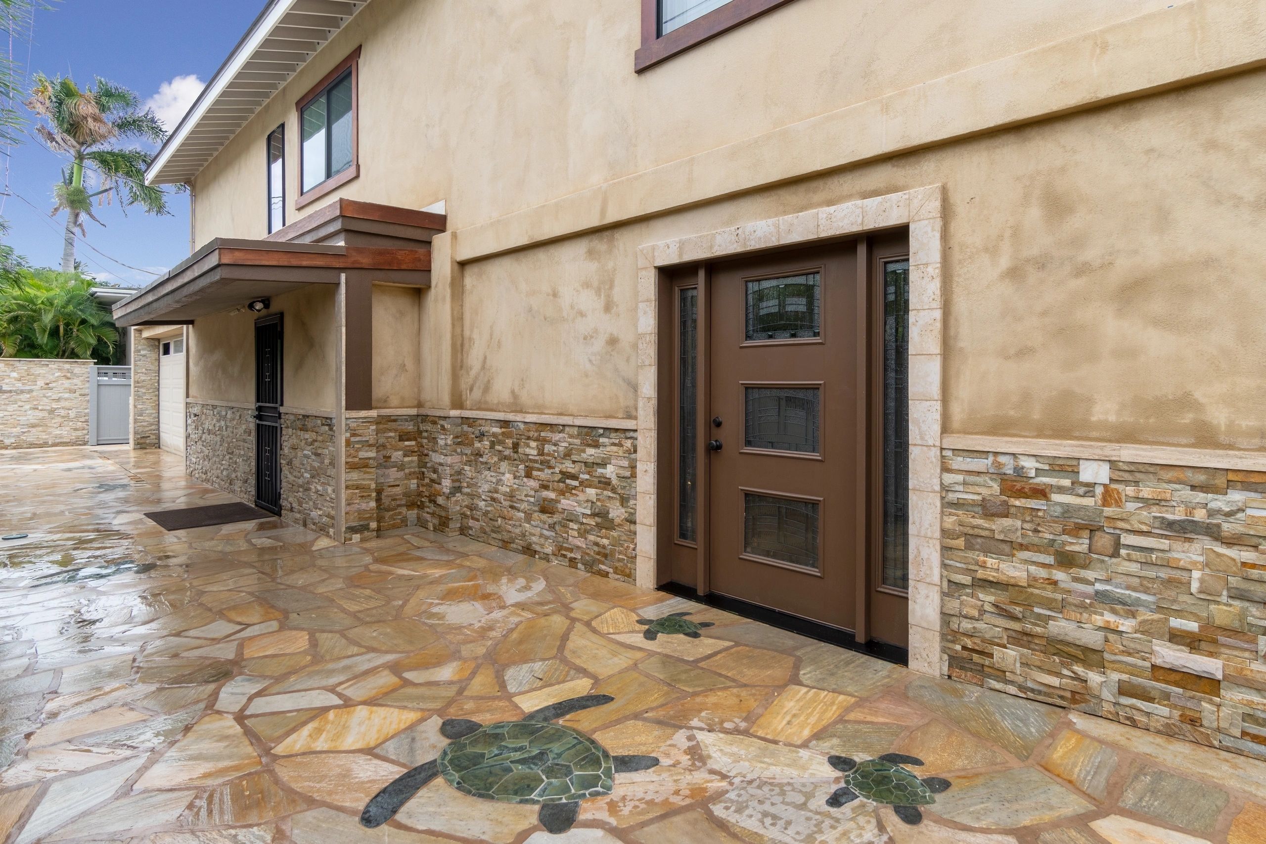 Entry courtyard with flagstone paving and turtle inlays